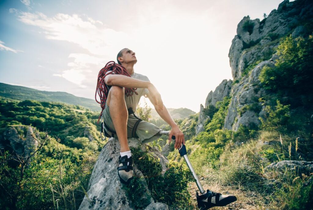 disability guy with a prosthetic leg in nature