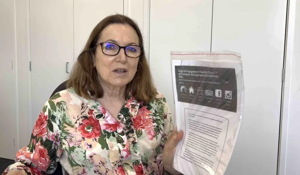 Catherine holding her health check