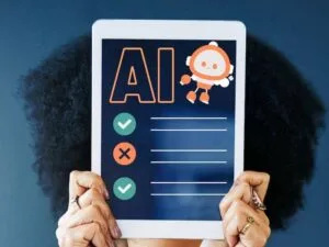 Person holding tablet displaying AI checklist with robot character and tick/cross marks.