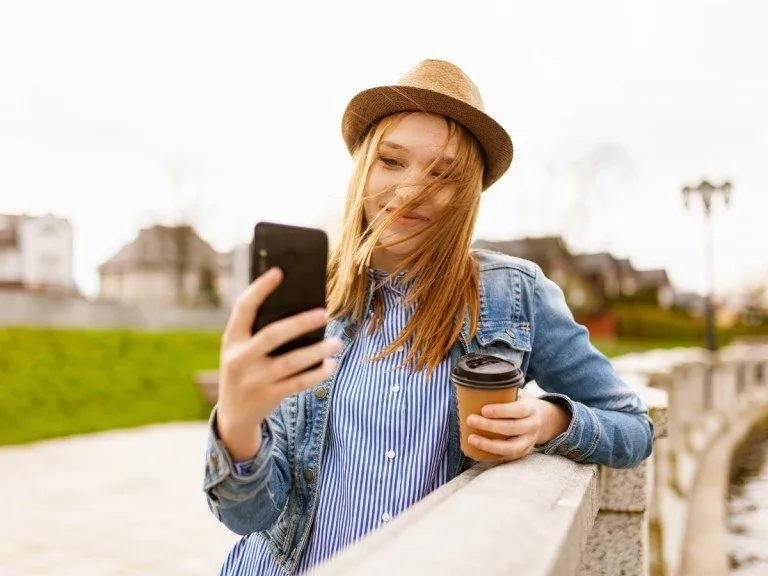 Influencer takes selfie with coffee