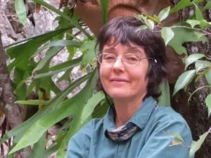 Sarah Isaacs, naturopath and herbalist from Mareeba, among climbing plants.
