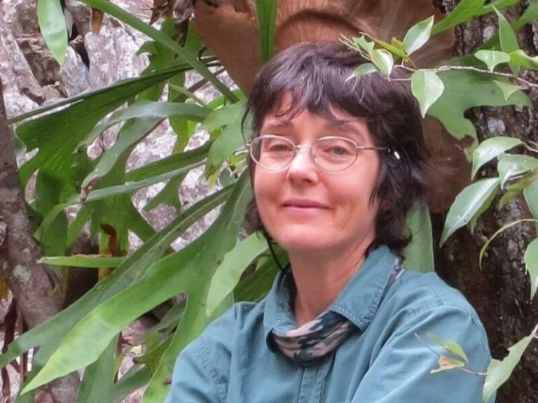 Sarah Isaacs, naturopath and herbalist from Mareeba, among climbing plants.