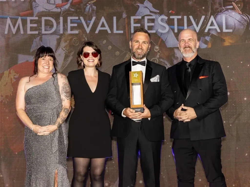 Abbey Medieval Festival accepts their 2026 national tourism award.