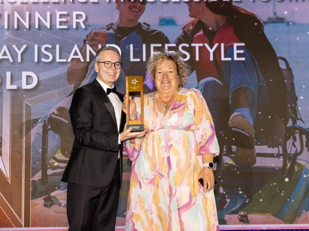 Bay Island Lifestyle accepts their 2026 national tourism award.